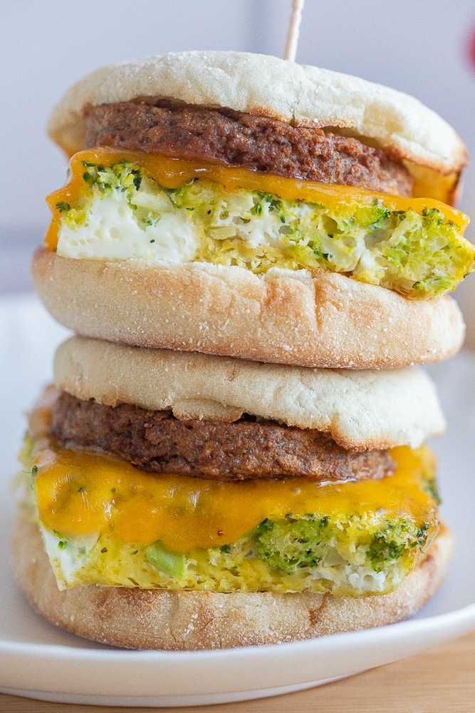 two vegetarian breakfast sandwiches stacked on top of eachother