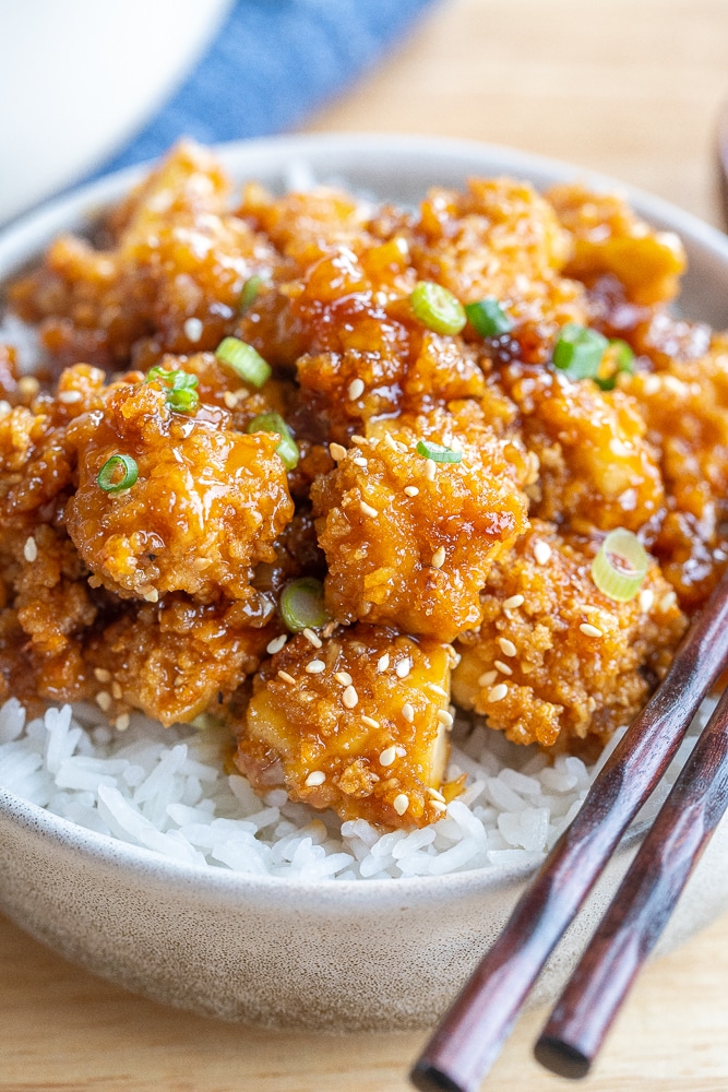 close up of crispy honey garlic tofu in a bowl
