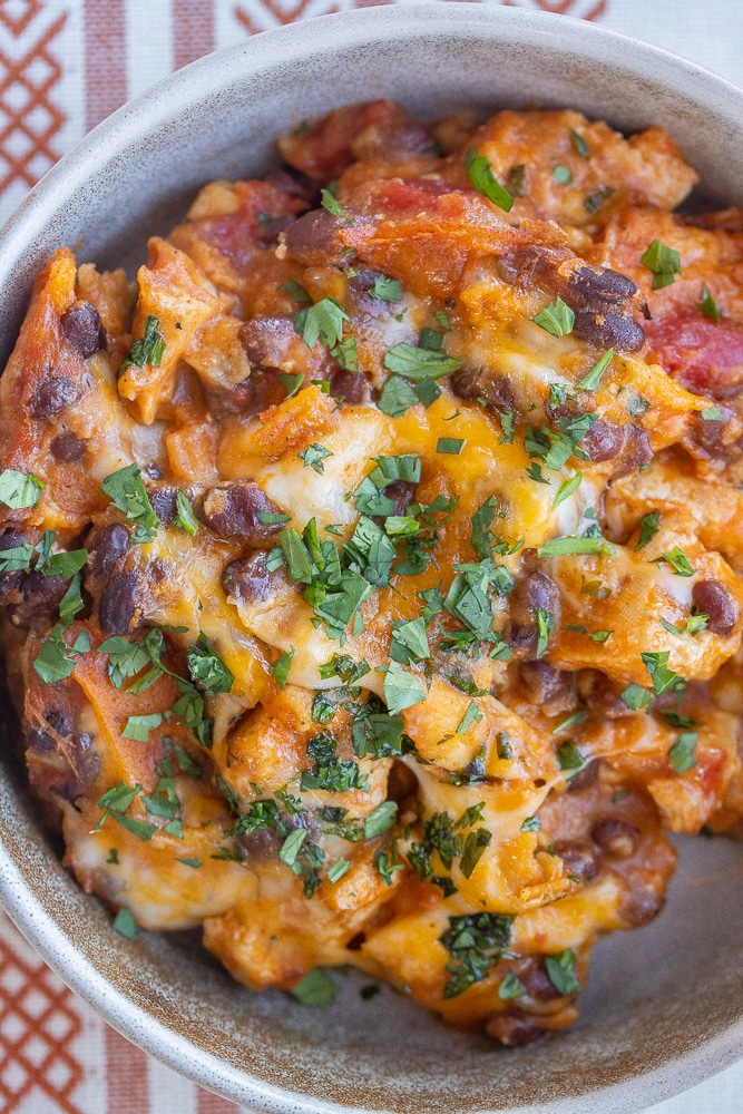 close up of vegetarian enchilada skillet in a bowl