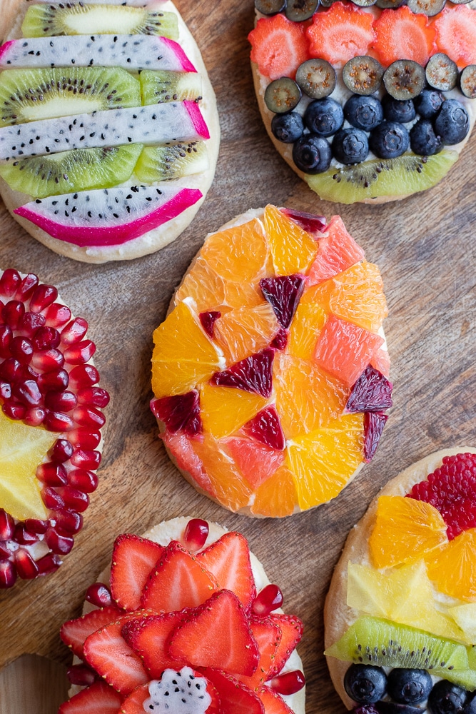 close up of brightly colored Easter Egg Cookies with fresh fruit and mascarpone cheese