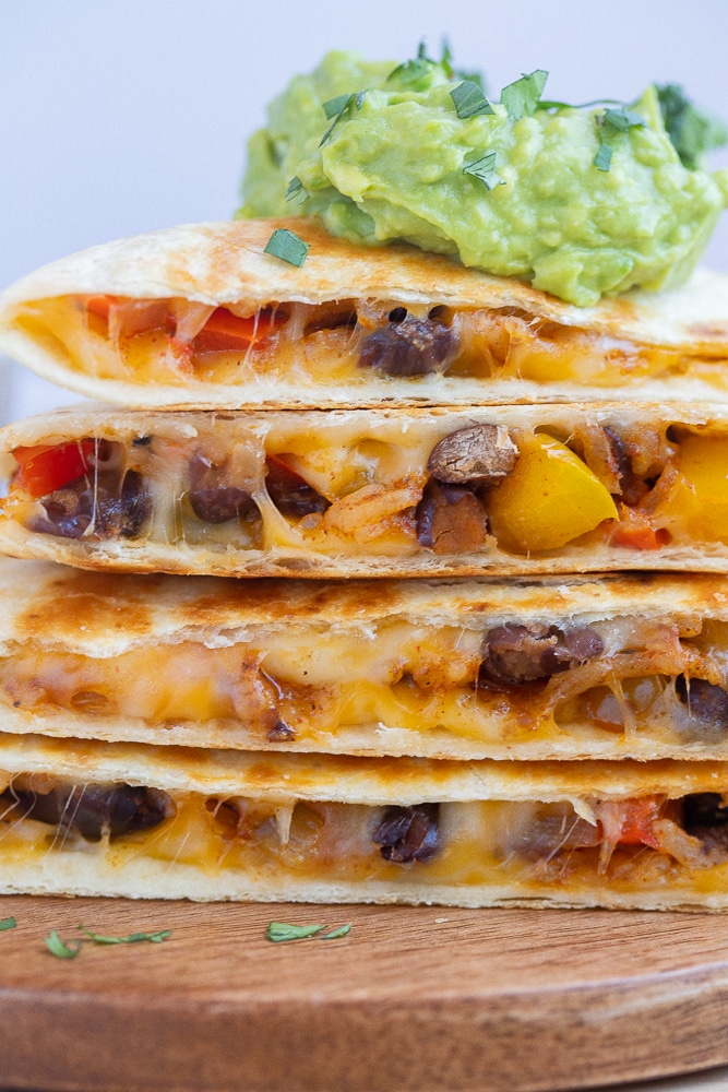 close up of vegetarian fajita quesadillas stacked on top of each other