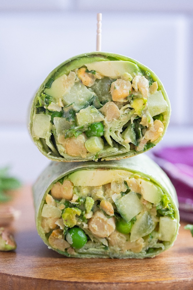 close up of green goddess chickpea wraps cut in half and stacked on eachother