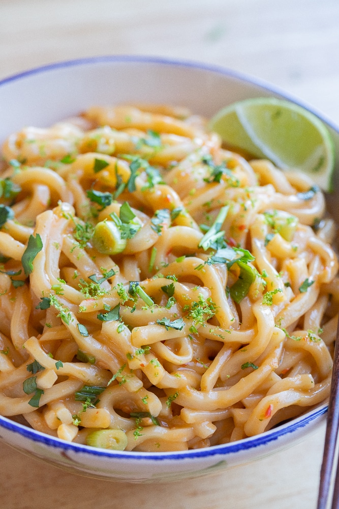 close up of a bowl of vegetarian spicy coconut noodles