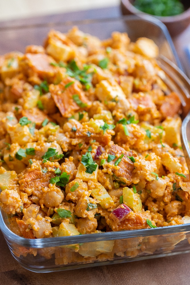 close up of a meal prep container filled with vegetarian buffalo chickpea salad