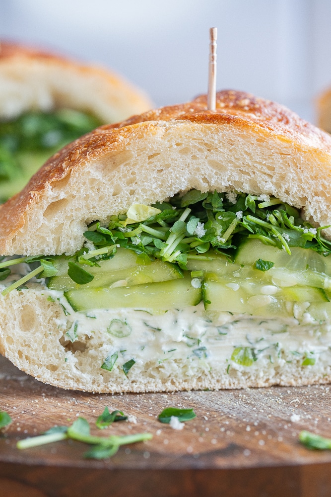 close up of a cucumber cream cheese sandwich