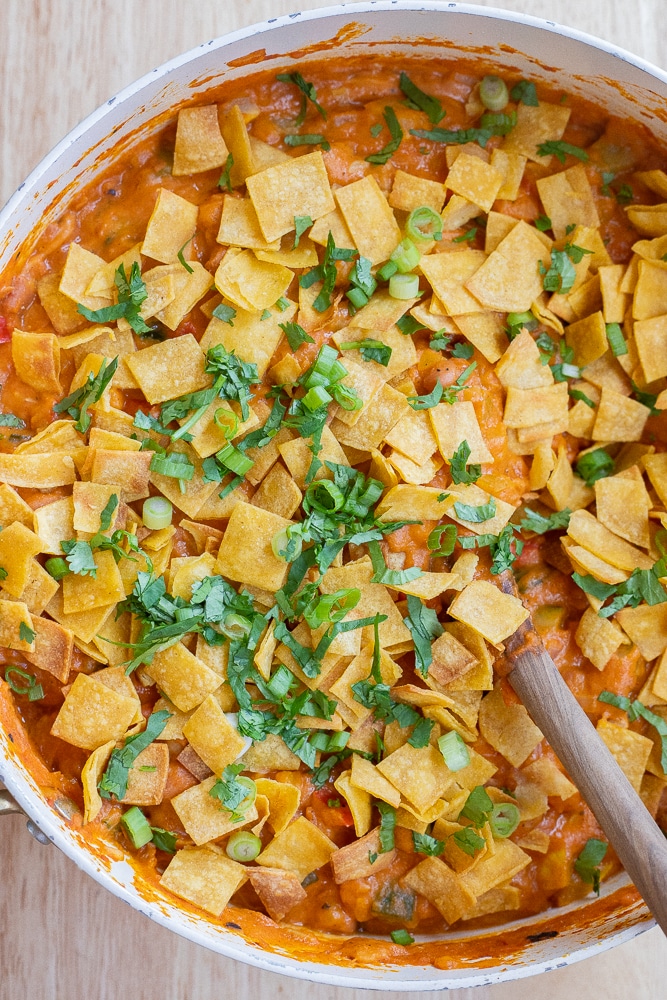 vegetarian pumpkin pinto bean taco skillet topped with fresh herbs