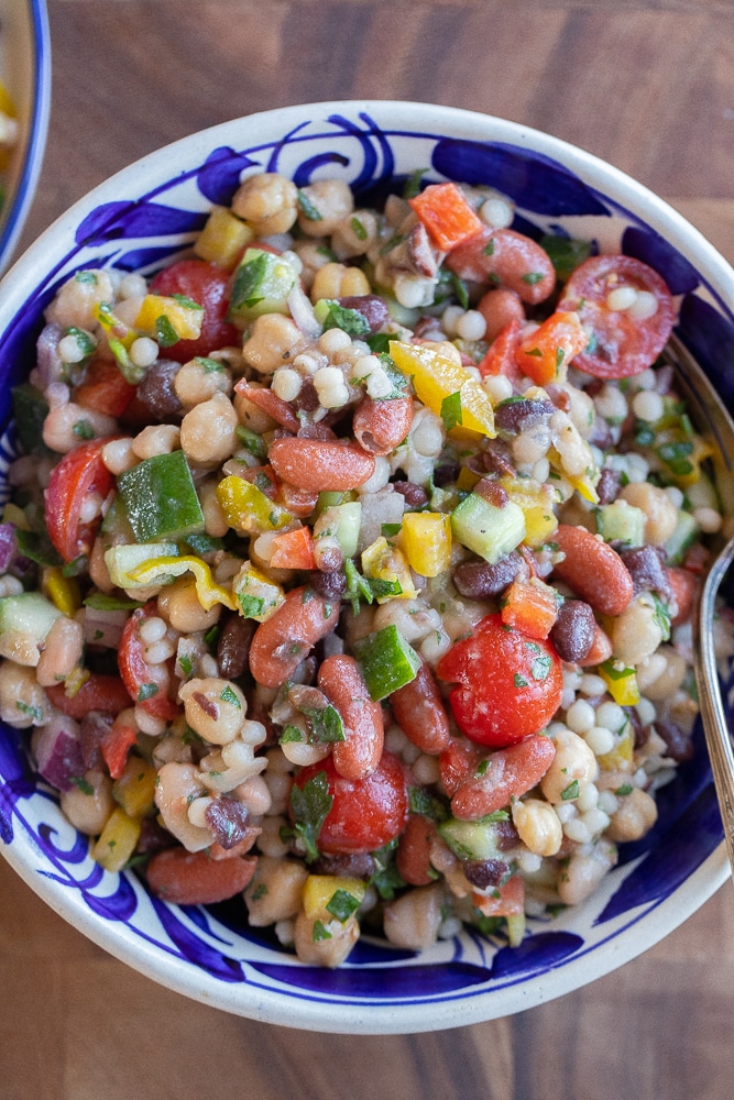 close up of a bowl of four bean couscous salad