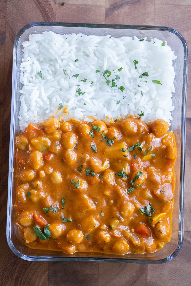 meal prep container full of pumpkin curry and white rice