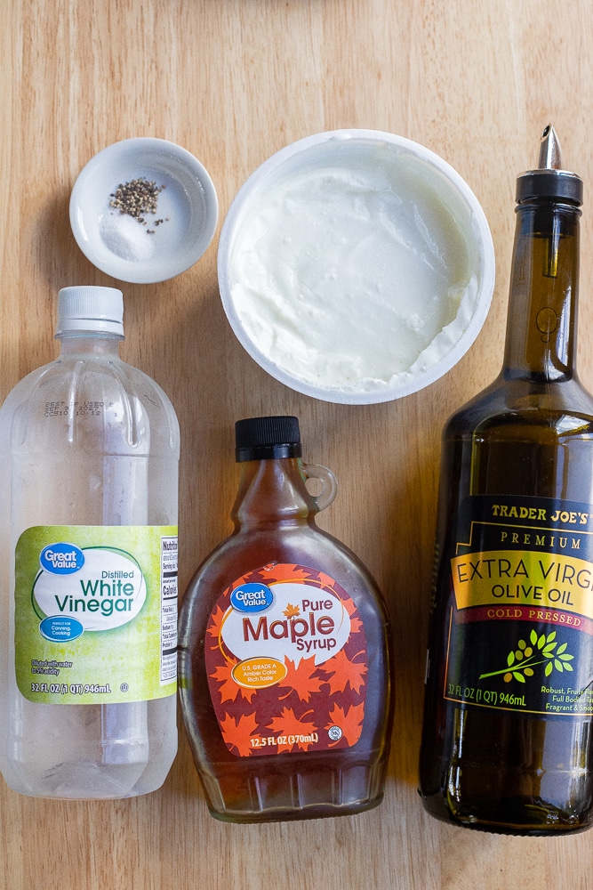 showing the ingredients needed to make this easy herby greek yogurt dressing