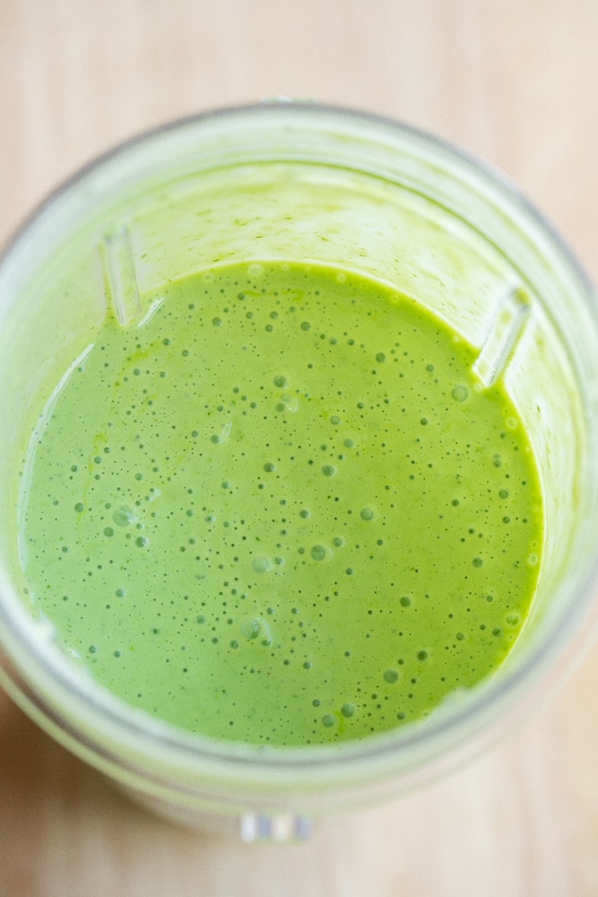 herby yogurt dressing blended up in a ninja blender