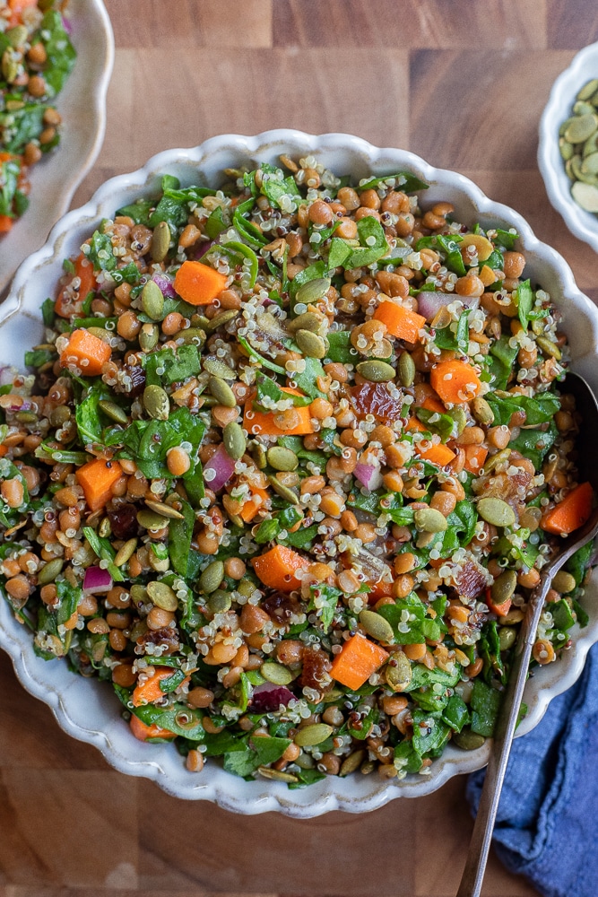 Bowl of iron rich spinach lentil salad with quinoa