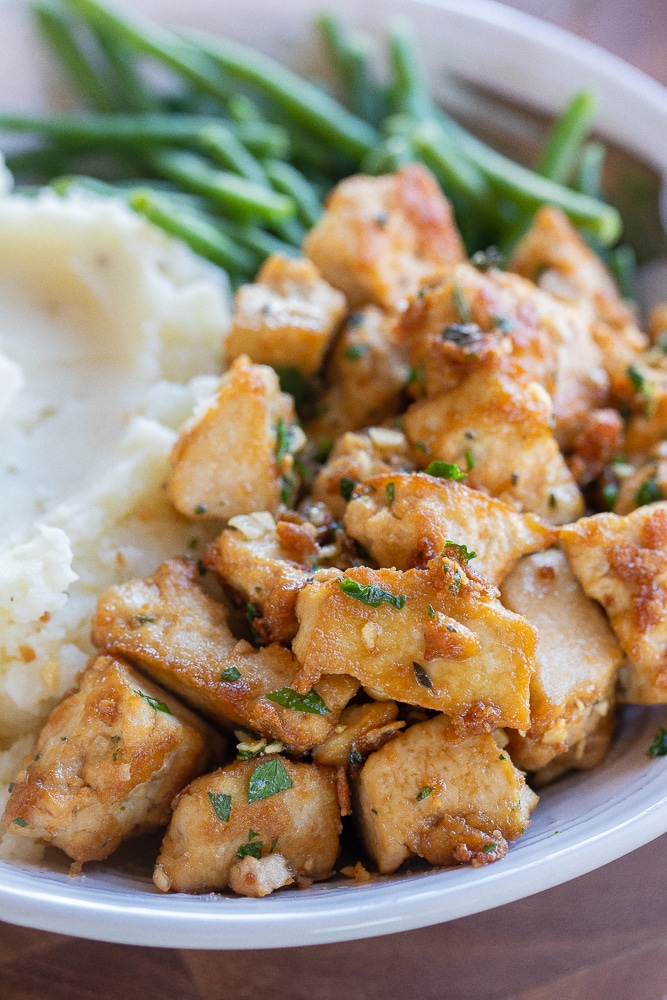 close up of browned butter garlic tofu in a bowl