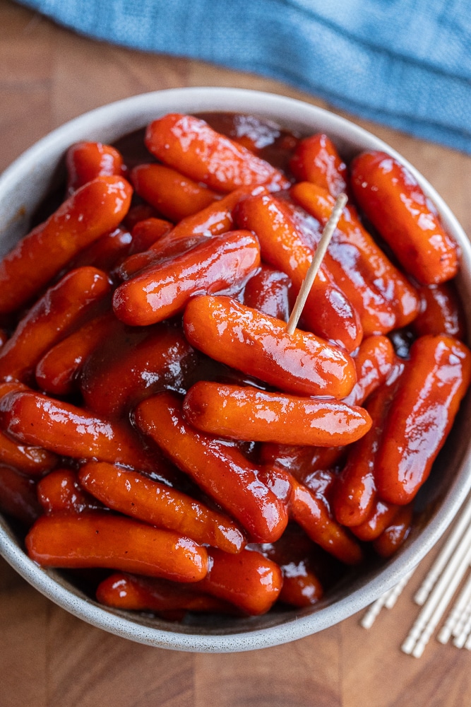 bowl full of vegetarian little smokies with a toothpick