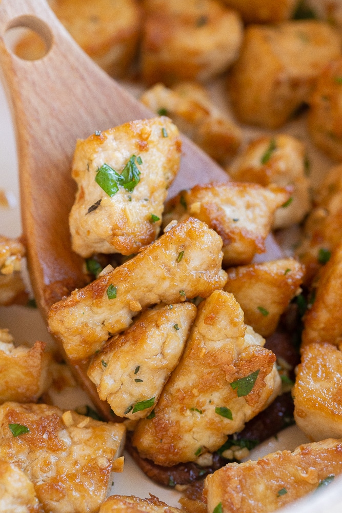 Close up of garlic butter tofu in a pan