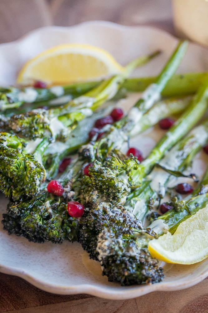 close up of roasted broccolini on a plate