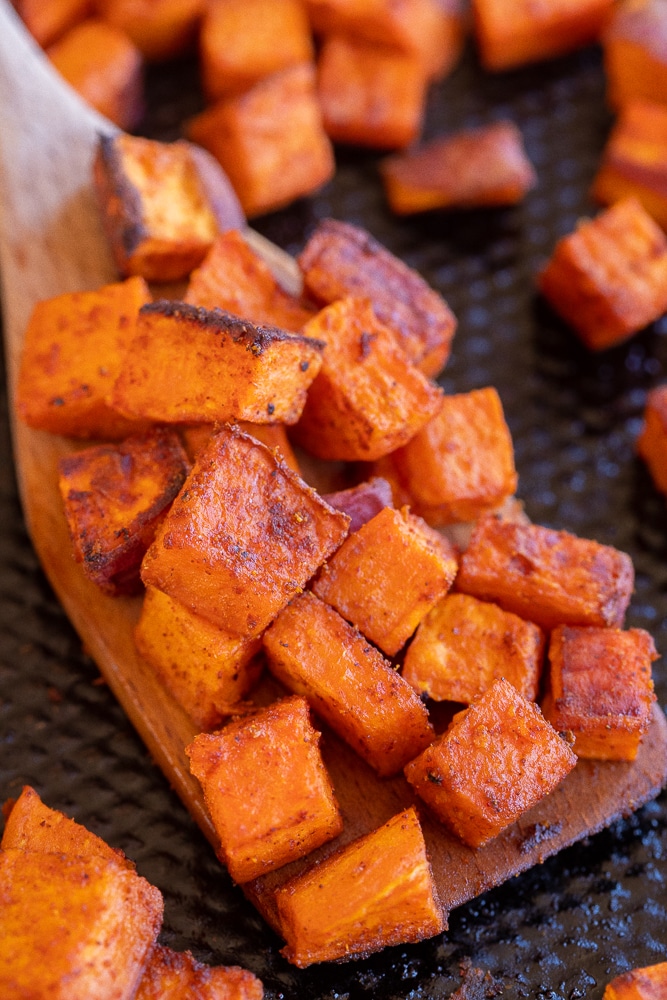 close up of roasted sweet potatoes on a spatula