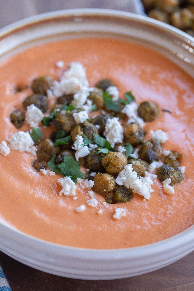 close up of a bowl of cozy tomato feta soup